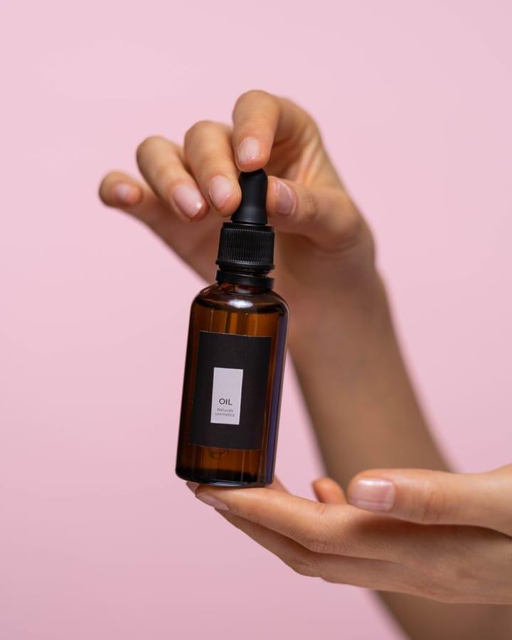 Example Instagram ad: a hand holding a serum bottle